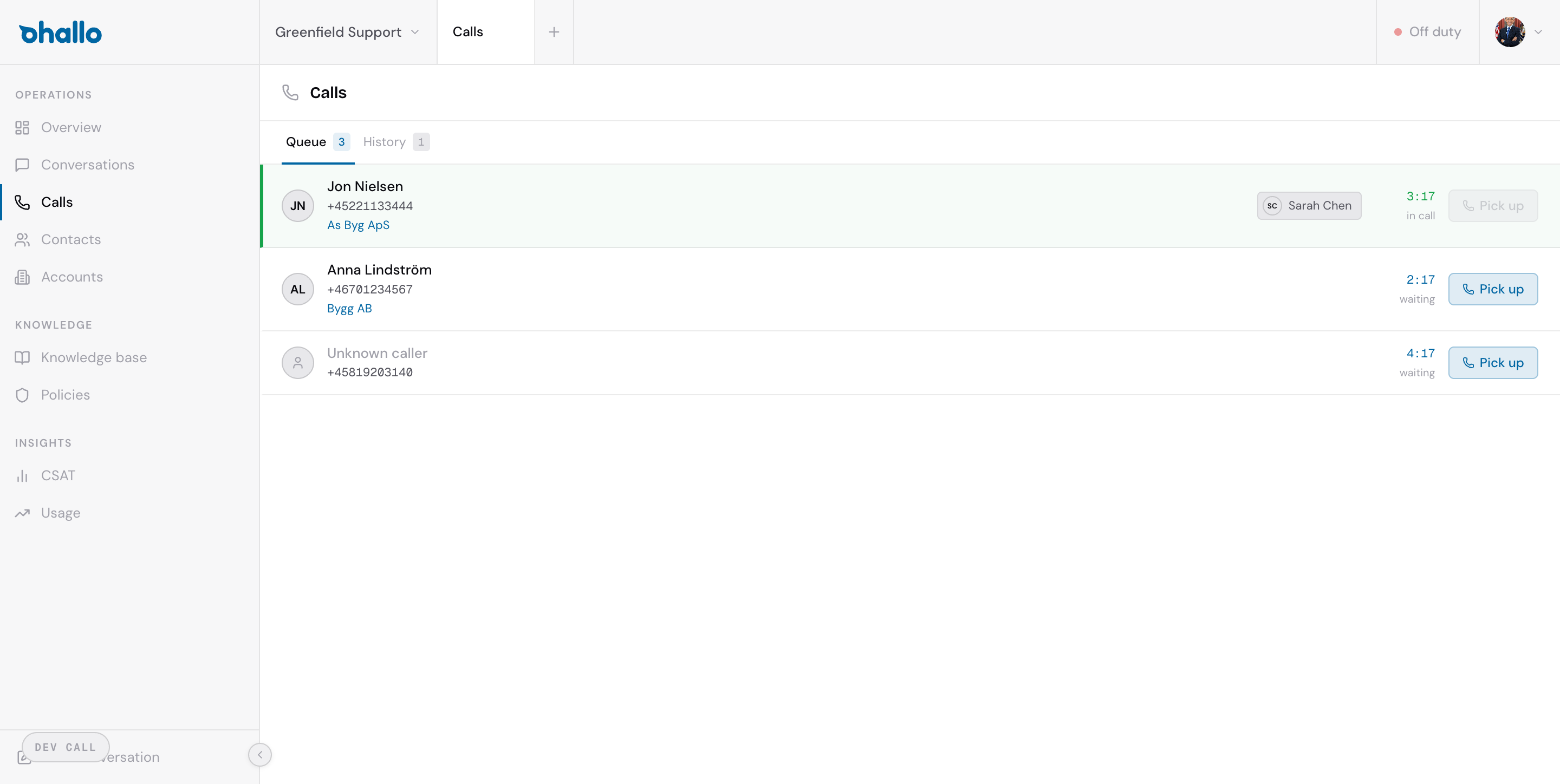 Call management dashboard showing a live call queue with caller names, phone numbers, linked accounts, and pick-up buttons